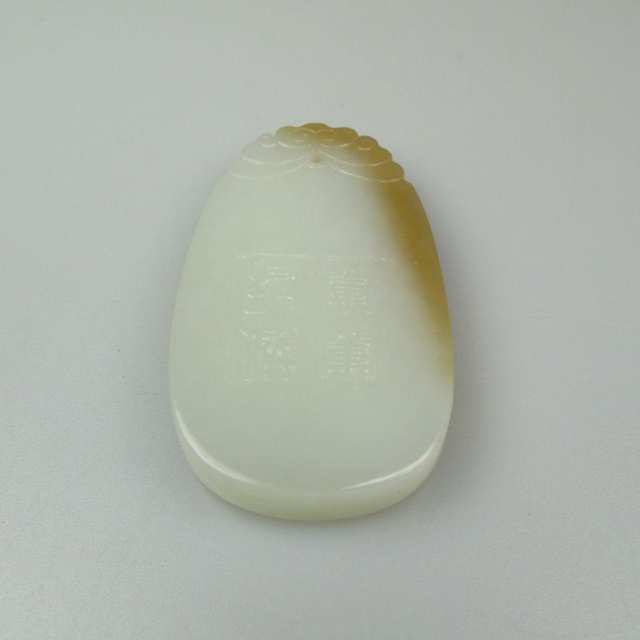 Oval Carved White To Brown Jadeite Pendant