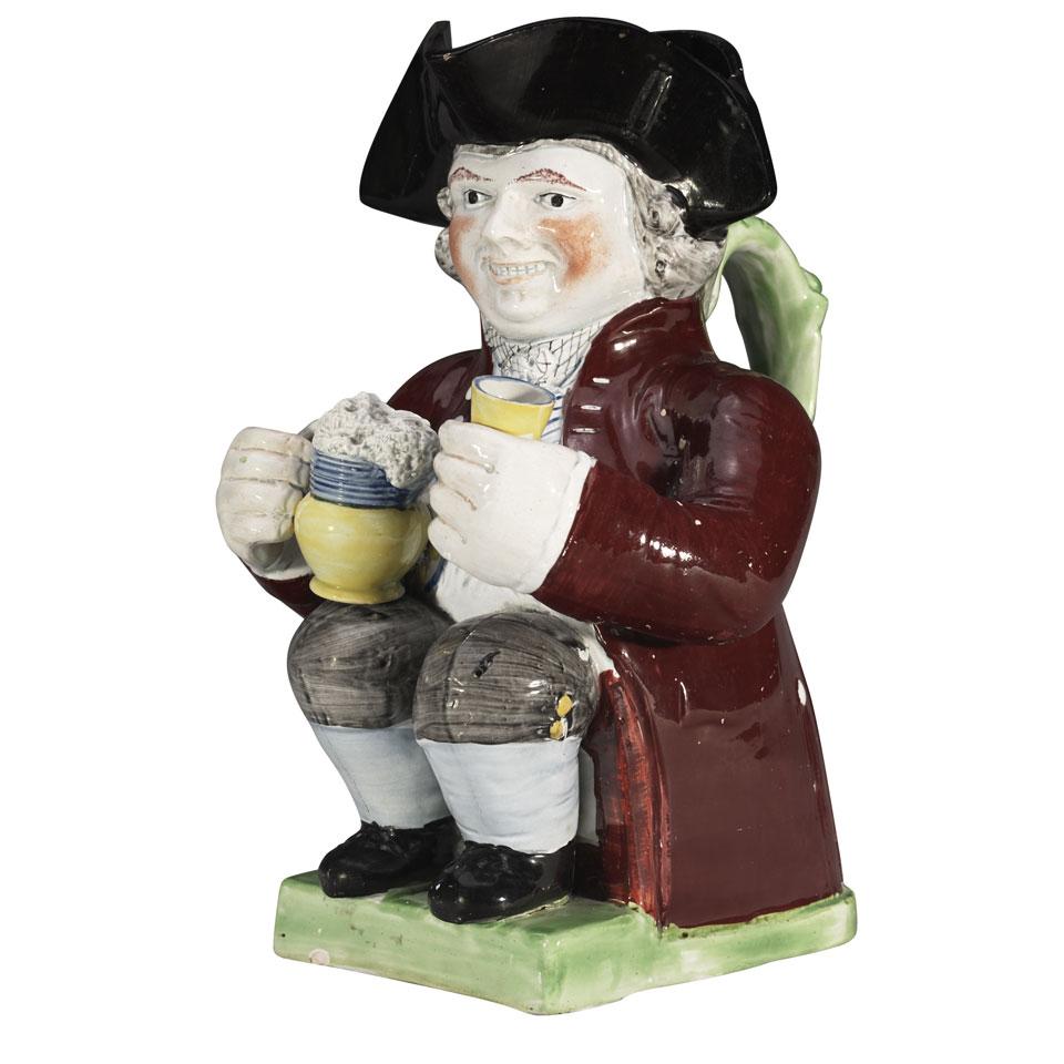 Staffordshire Pearlware ‘Large Hands’ or ‘Coachman’ Toby Jug, early 19th century