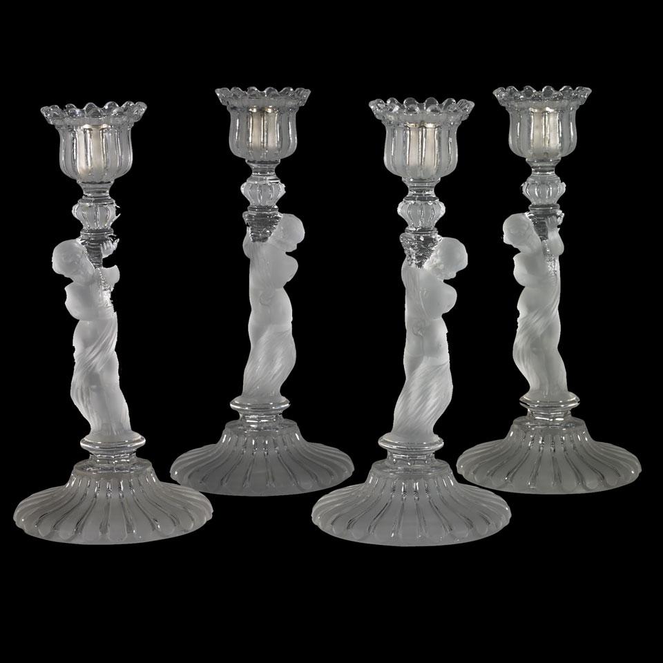 Set of Four Baccarat Moulded and Frosted Glass Figural Candlesticks, early 20th century