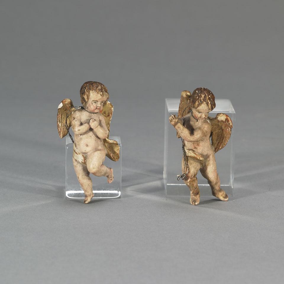 Two Italian Miniature Carved, Parcel Gilt and Polychromed Putti, 19th century