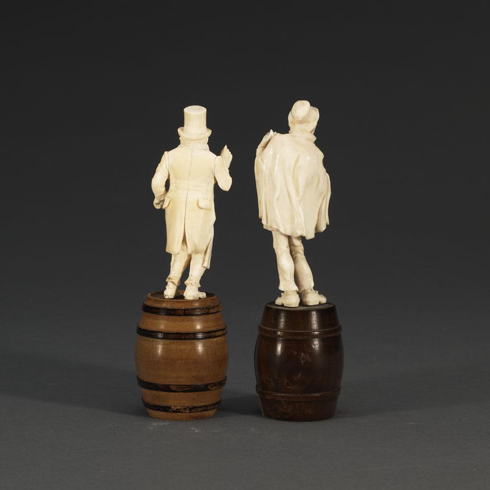 Two German Carved Ivory Figures of Street Musicians Standing on Wooden Barrels, c.1900