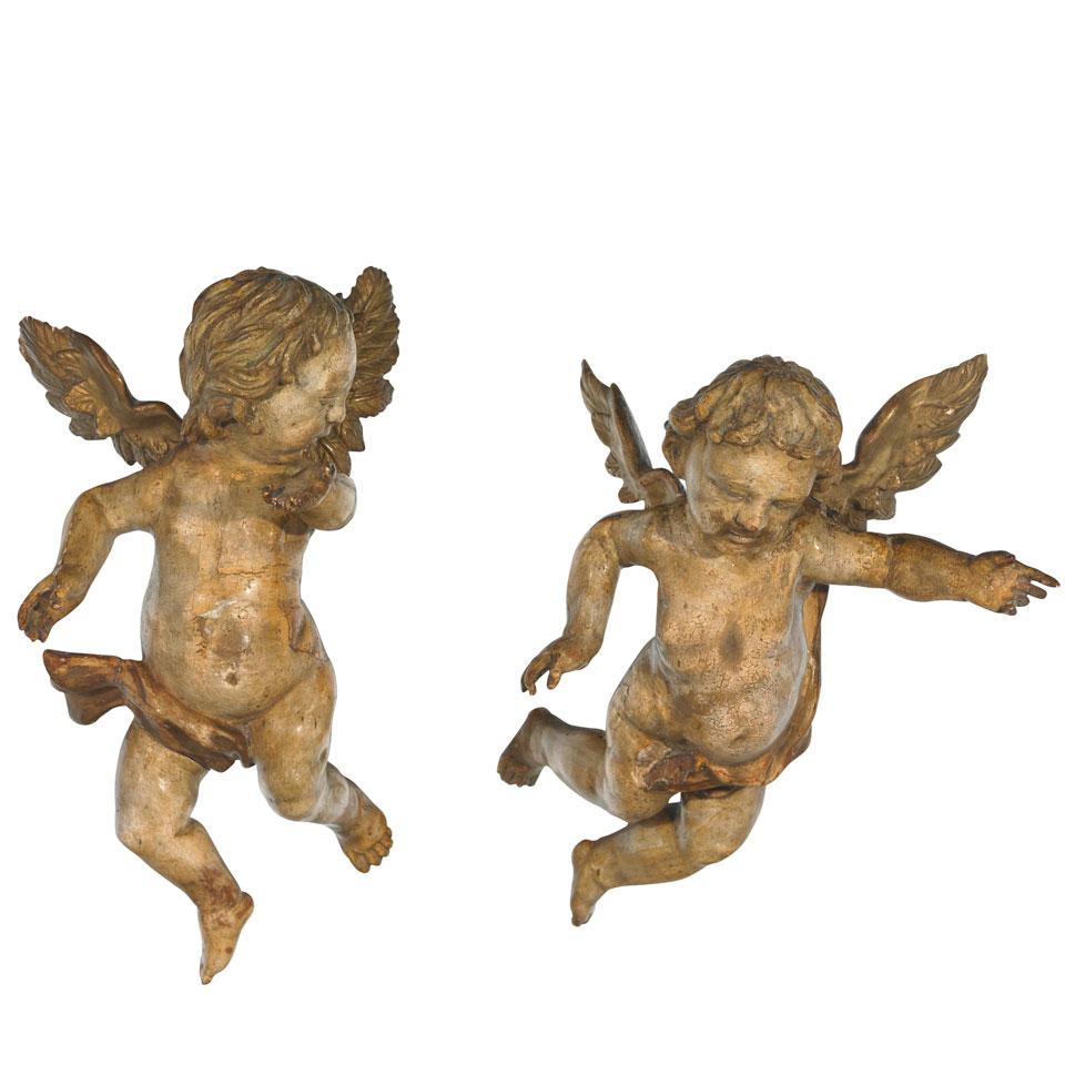 Pair of Italian Baroque Carved, Polychromed and Parcel Gilt Putti, 18th century