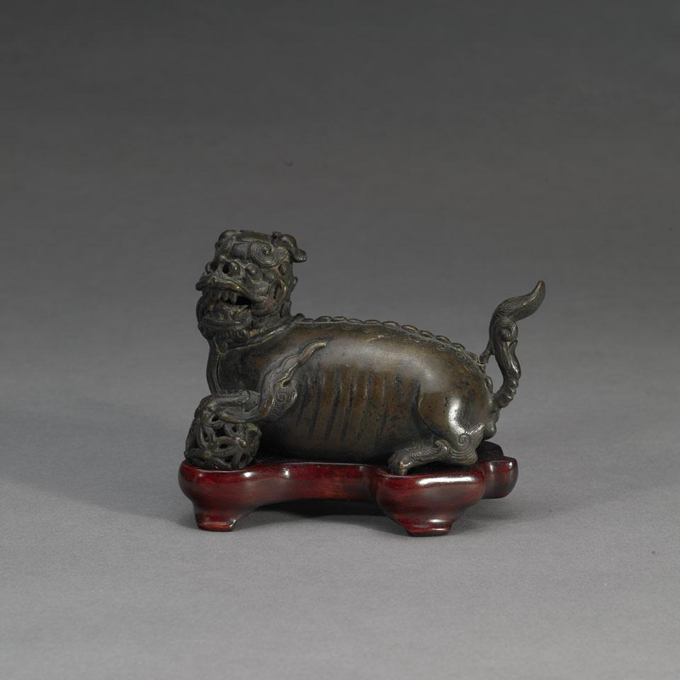Bronze Figure of a Buddhist Lion and Brocade Ball