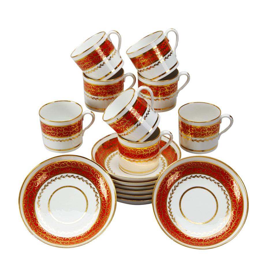 Eight English Porcelain Orange and Gilt Banded Coffee Cans and Saucers, c.1805-10