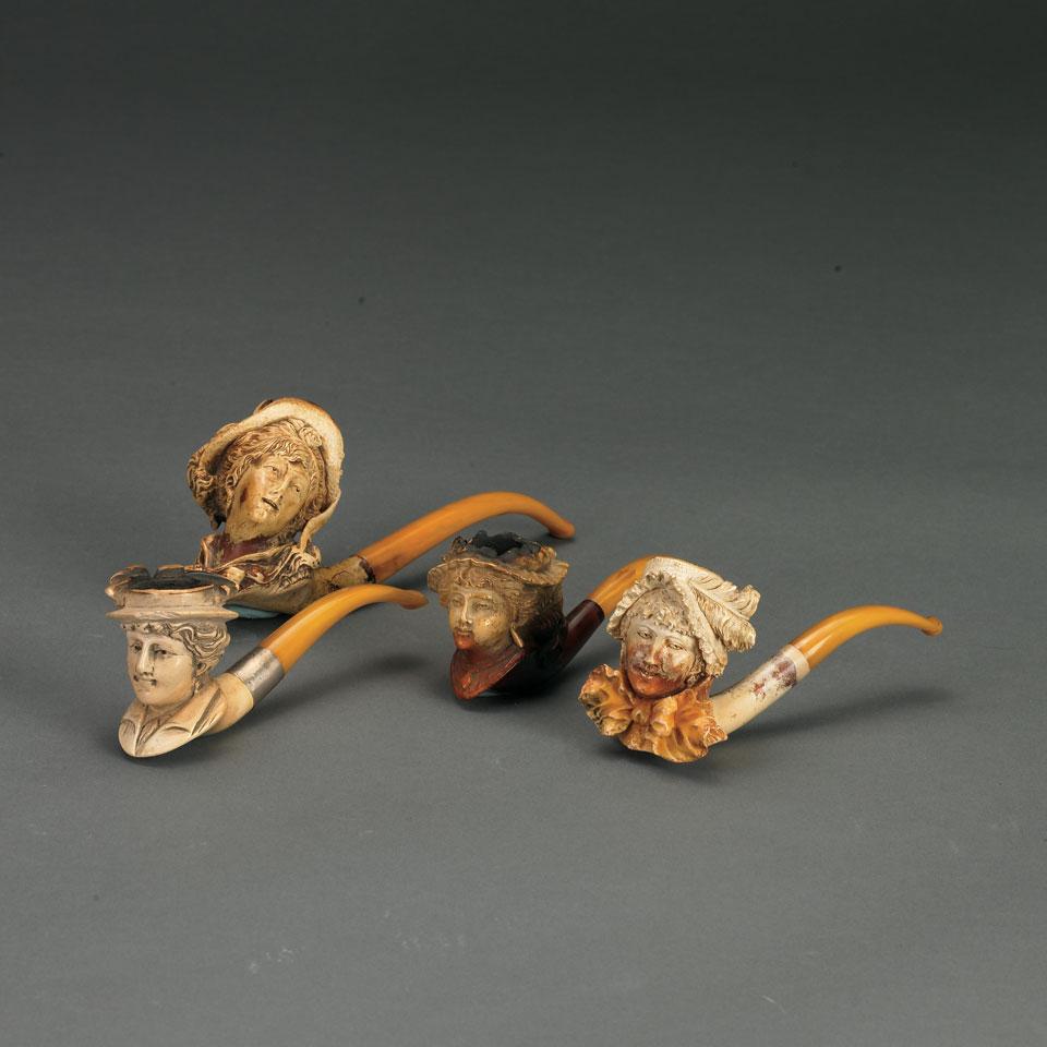 Four Carved Meerschaum Pipes Formed as Heads of Young Women, late 19th century