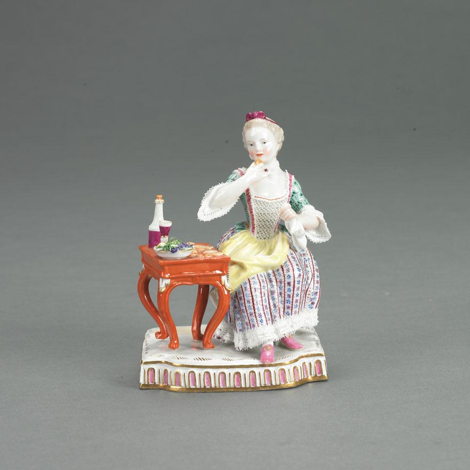 Meissen Figure of a Young Woman at a Table, late 19th century