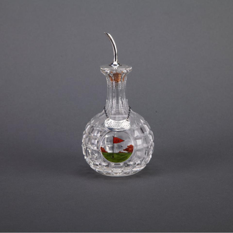 [Golfing] Enameled ‘19th Hole’ Cut Glass Whiskey Carafe with English Silver Label and Spout, Hukin & Heath, Birmingham, 1922/28
