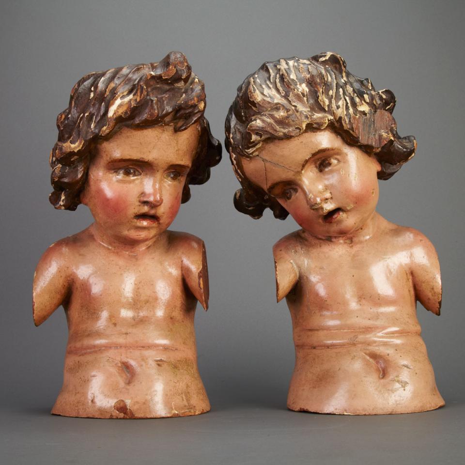 Pair of Italian Carved and Polychromed Cherub Form Architectural Fragments, early 19th century