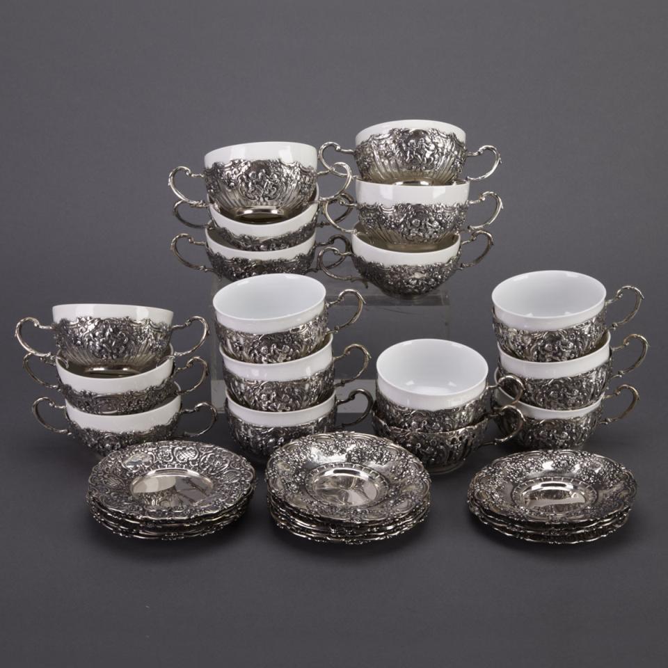 Eight German Silver Tea Cups and Saucers and Nine Matching Soup Cups and Stands, 20th century