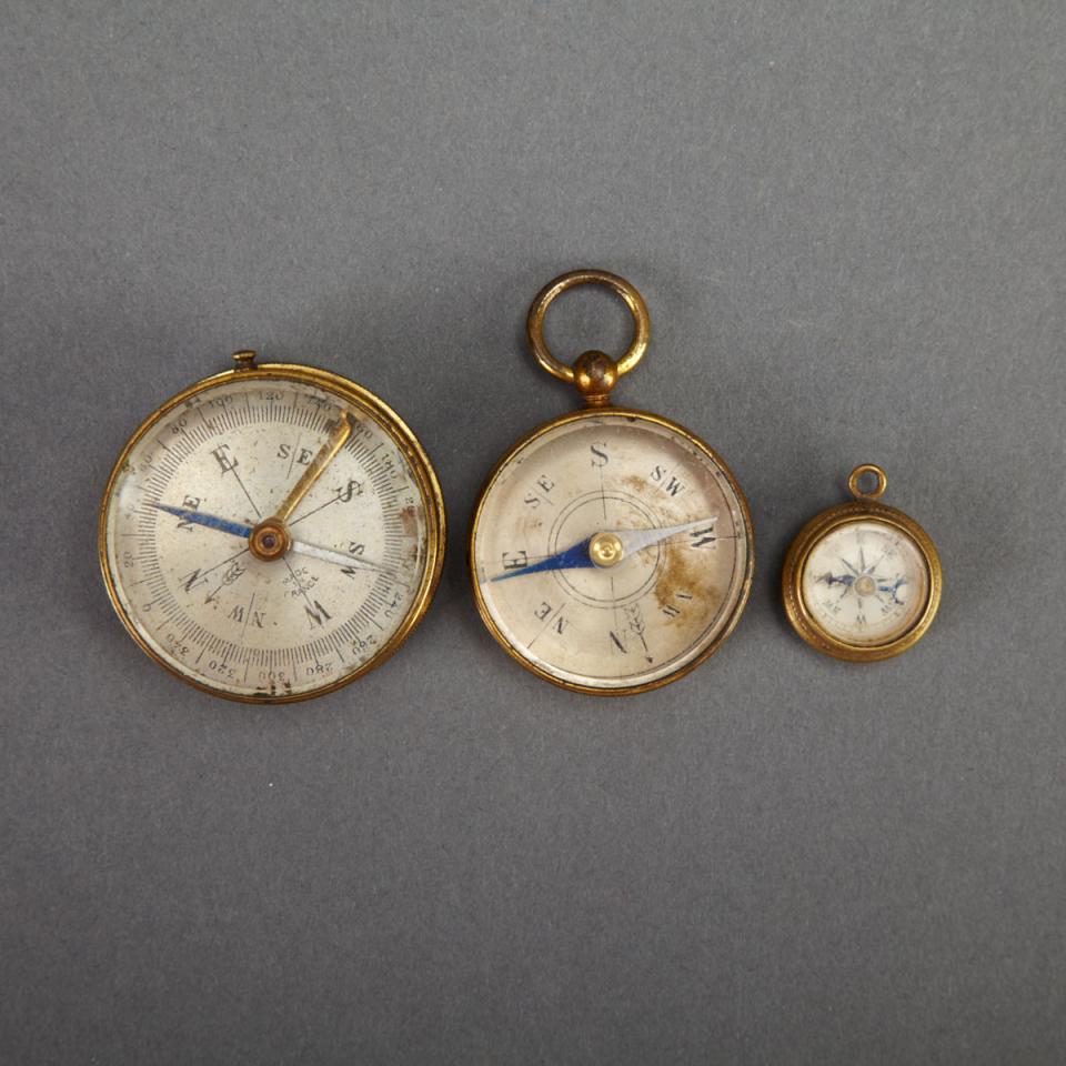 Two French Lacquered Brass Pocket Compasses and a Fob Compass, 19th century