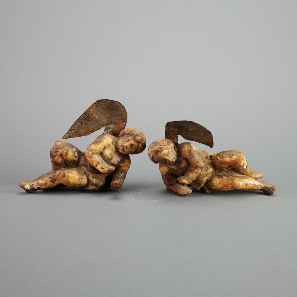 Pair of Quebec Carved Polychromed and Parcel Gilt Angel Form Architectural Fragments, 18th century