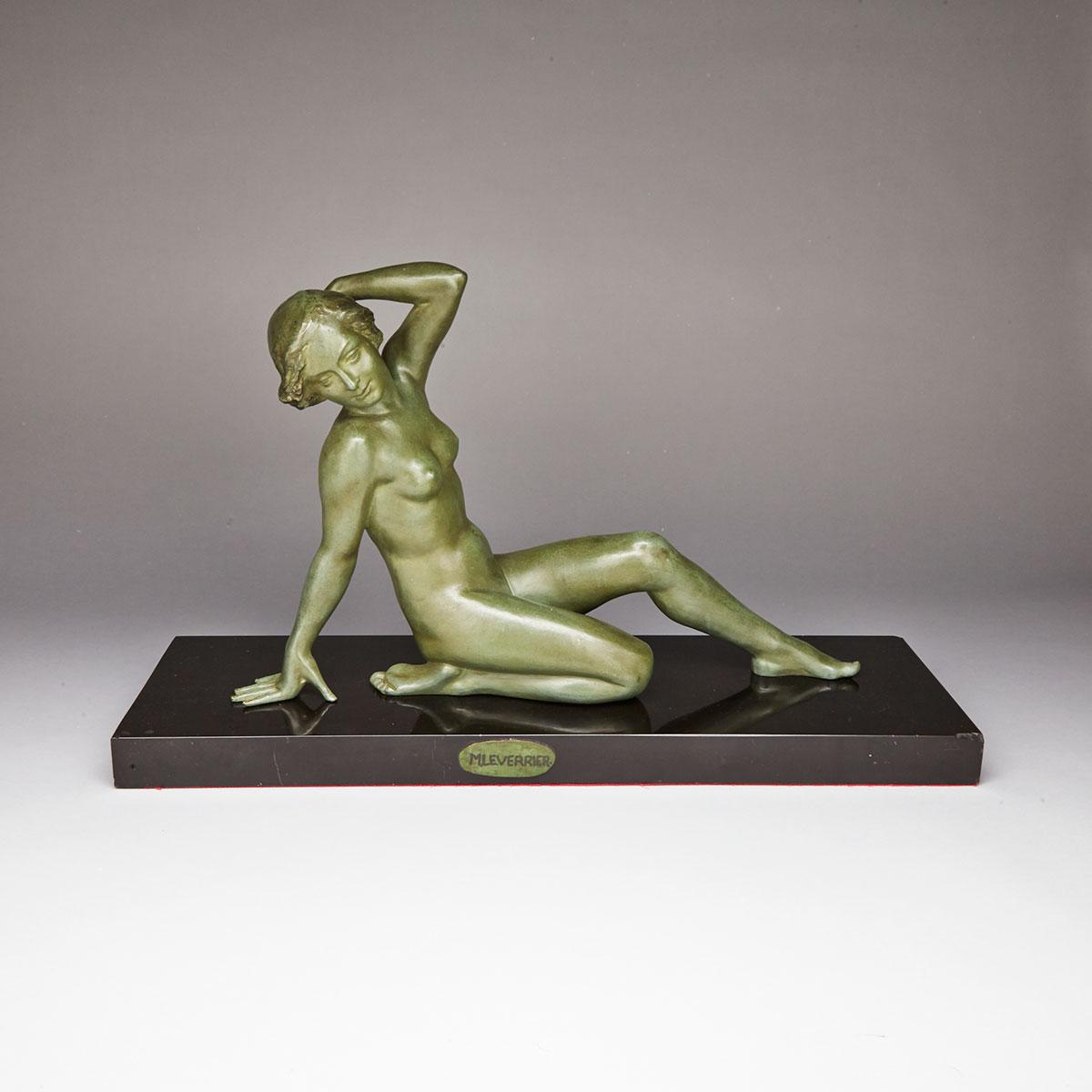 French Art deco patinated bronze figure of a reclining nude, mid 20th century