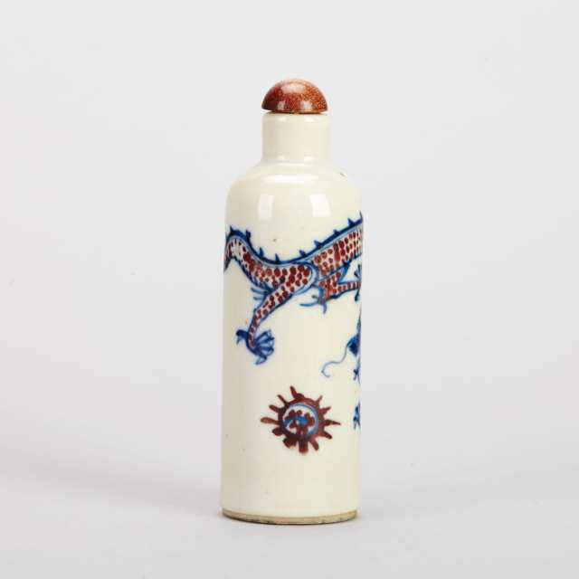 Four Blue, White and Copper Red Rouleau Snuff Bottles, 19th Century