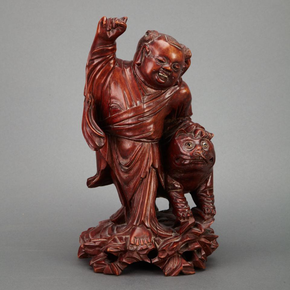 Rosewood Carved ‘Boy and Lion’ Group, Early 20th Century