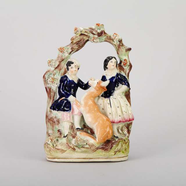 Two Staffordshire Swan Group Spill Vases and a Bower Group of Figures with a Deer, 19th century