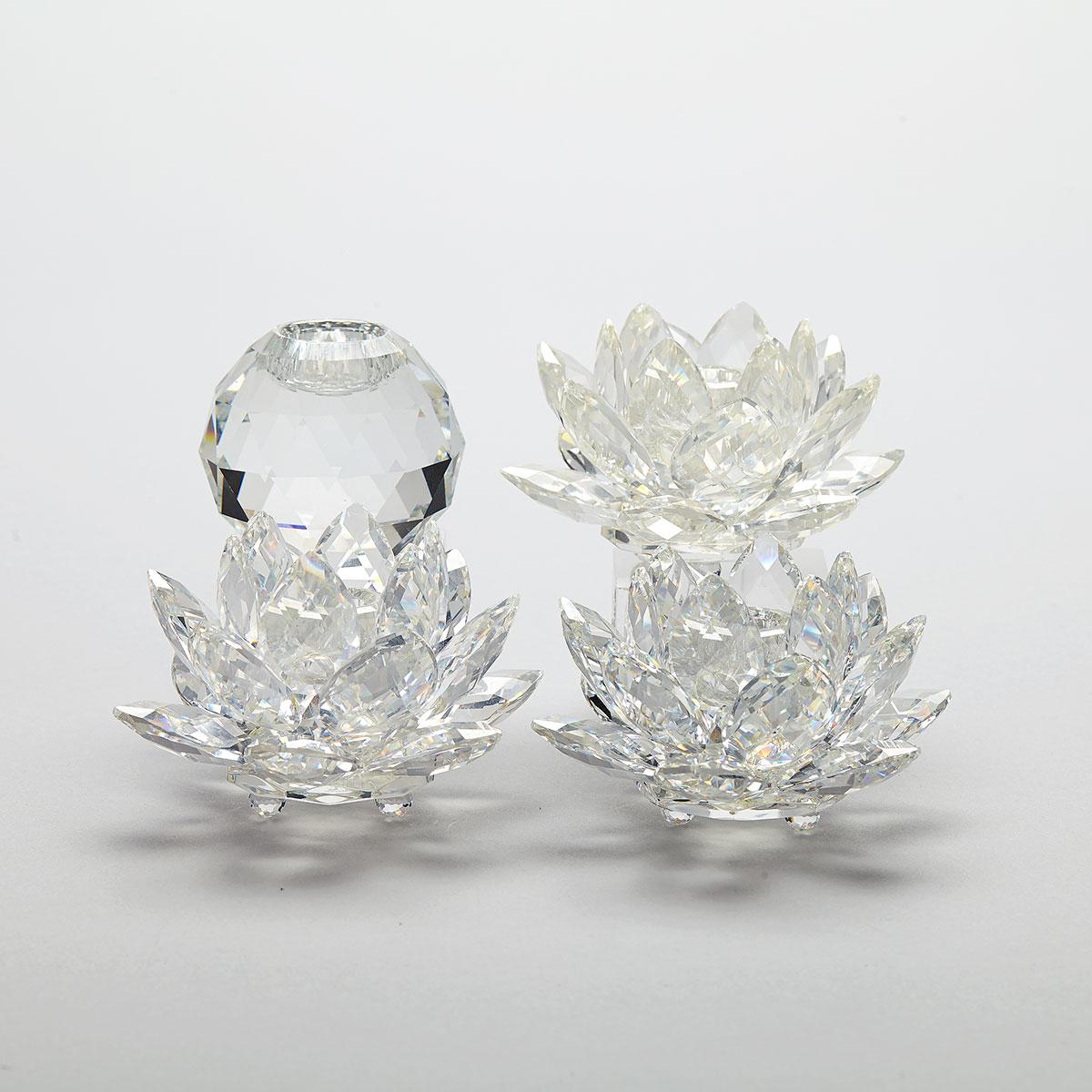 Three Swarovski Crystal Waterlily Candleholders and One King Global Candleholder, late 20th century