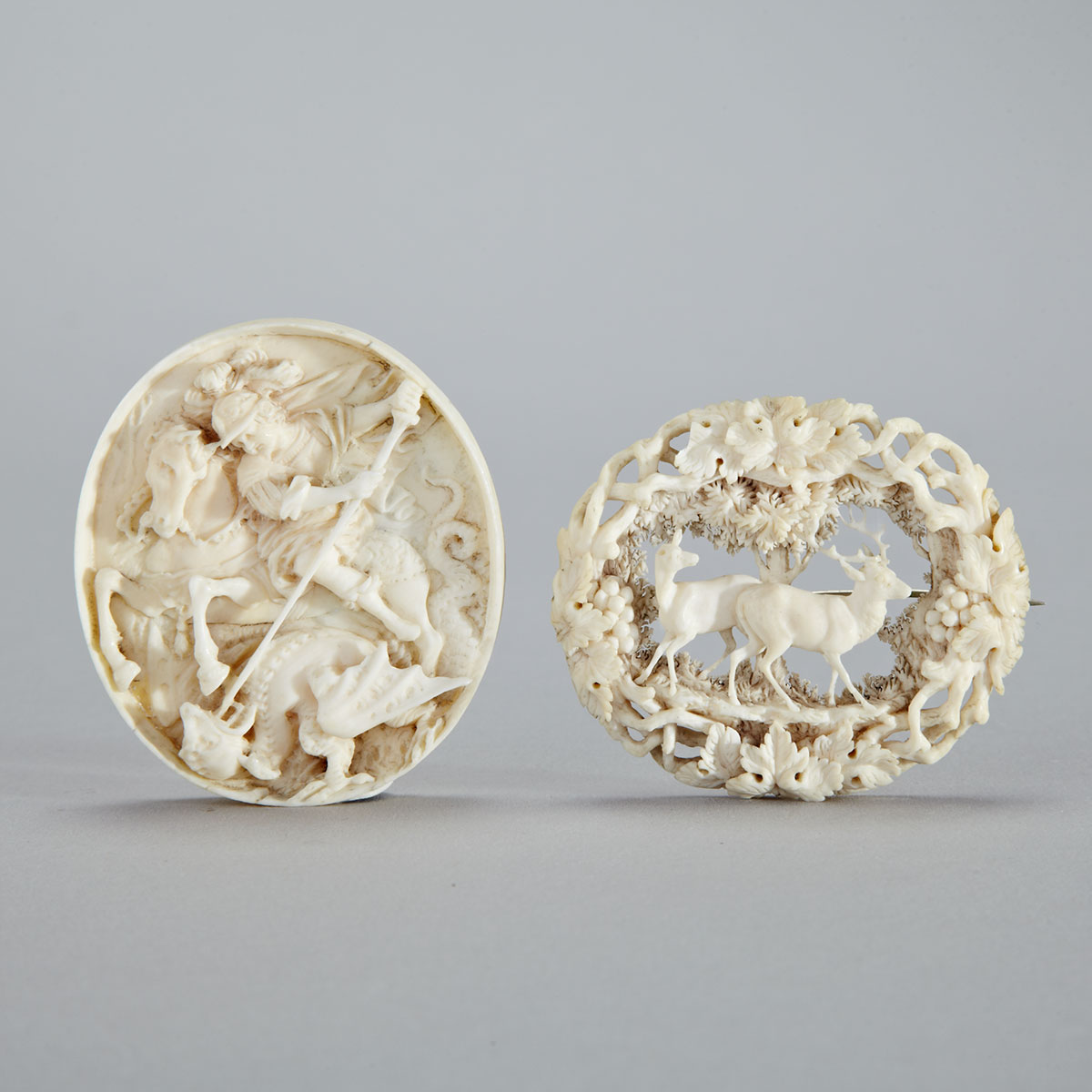 German Carved Ivory Oval Medallion and a Brooch, 19th century