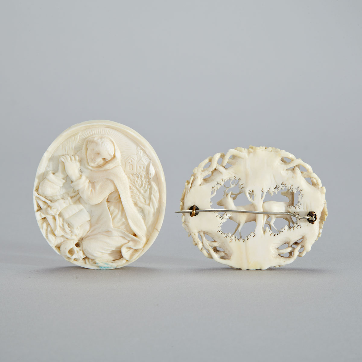 German Carved Ivory Oval Medallion and a Brooch, 19th century