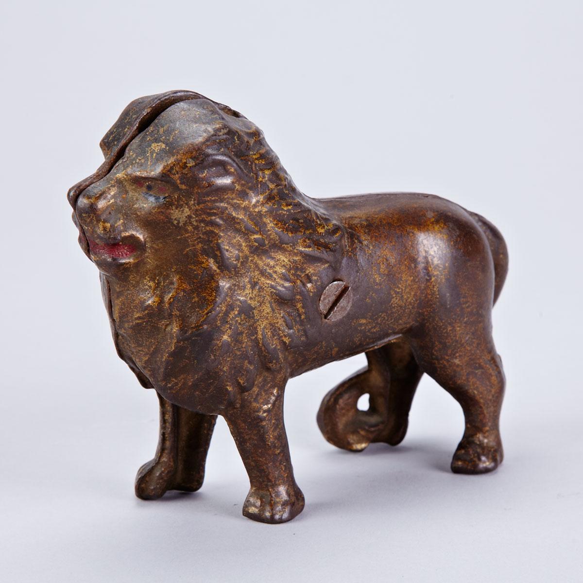 Painted Cast Iron Lion Form Still Penny Bank, 19th century