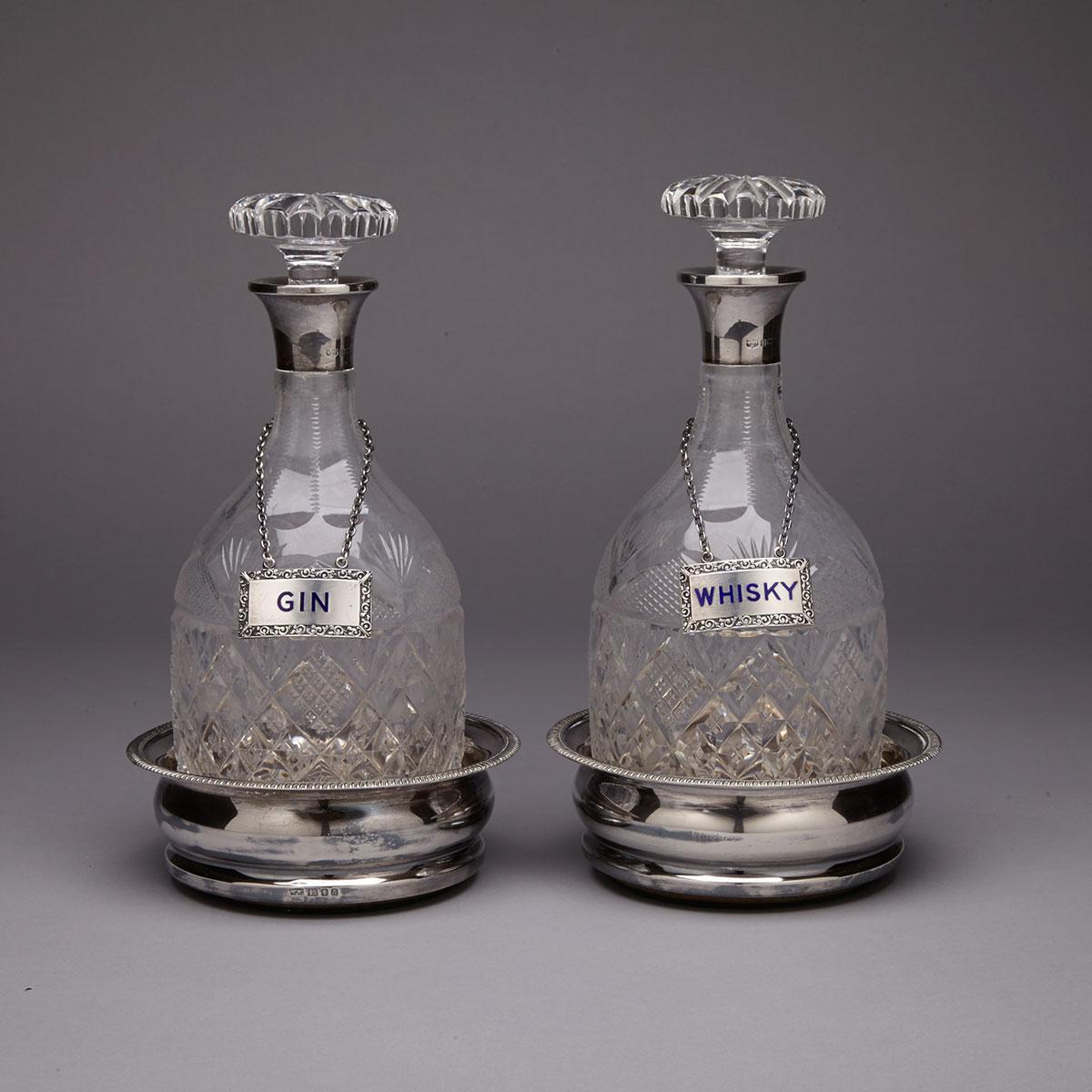 Pair of English Silver Mounted Cut Glass Spirit Decanters with Labels and Coasters, Mappin & Webb, Birmingham and London, 1968