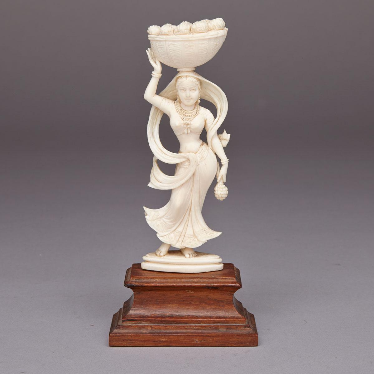 East Indian Carved ivory figure of a Fruit bearer