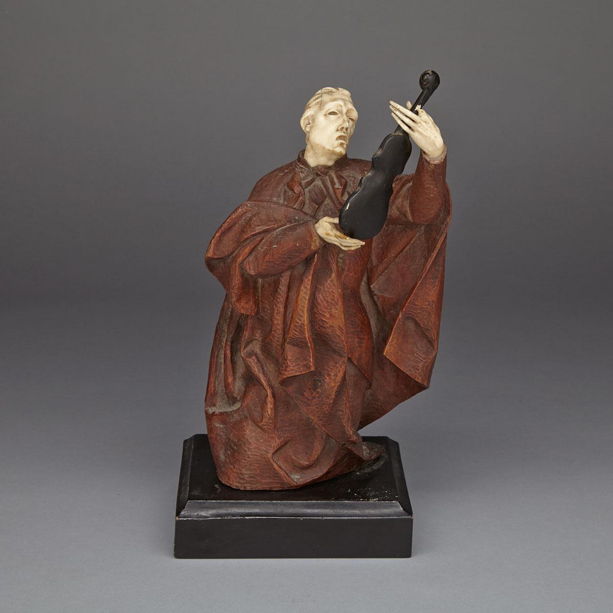 Continental Carved Walnut and Ivory Figure of a Man Adoring a Violin, 19th, early 20th century