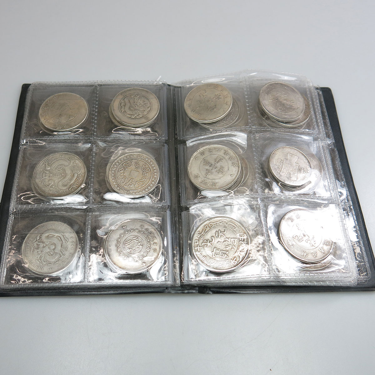 Binder Of 59 Silver Chinese Coins