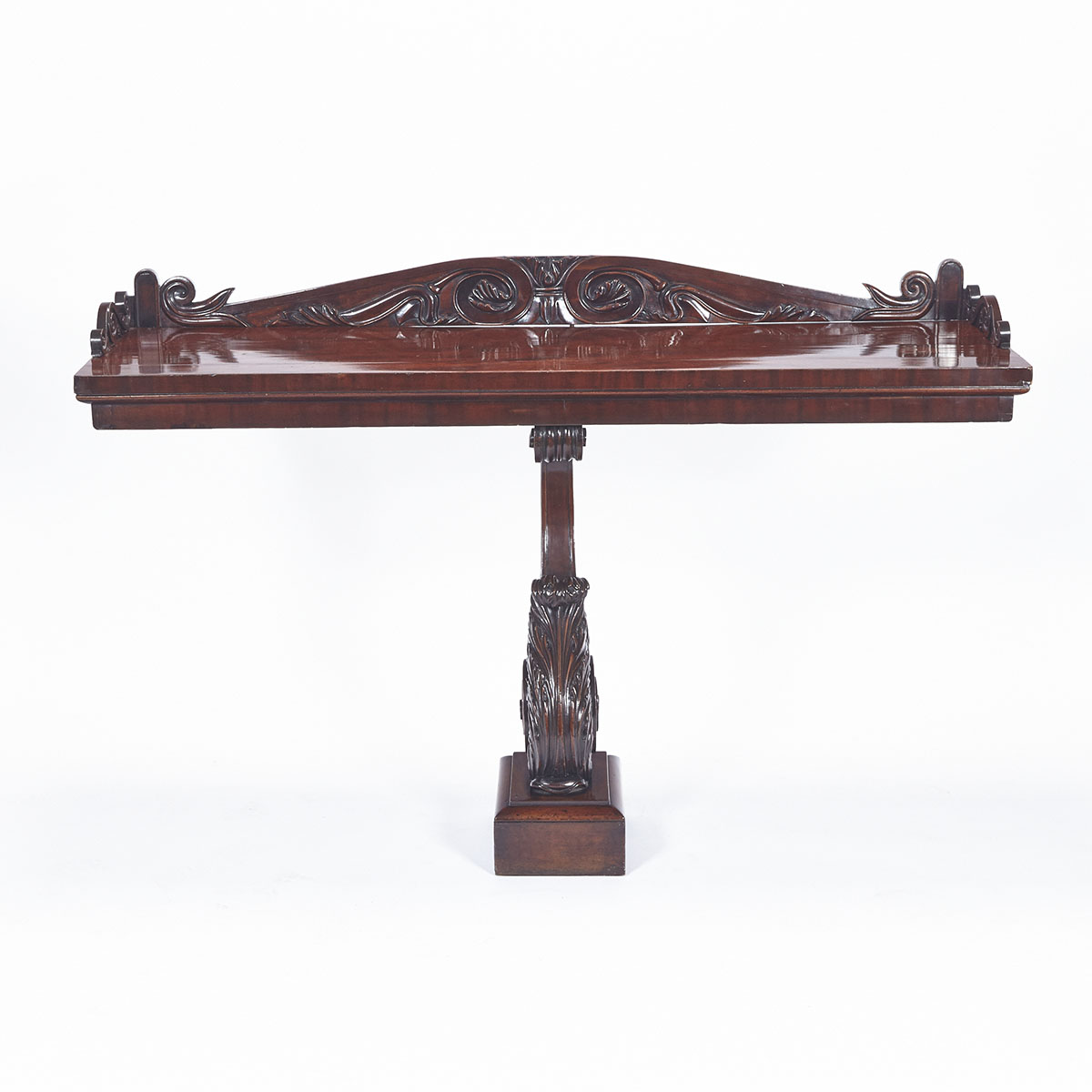 REGENCY MAHOGANY CONSOLE TABLE ON A FINELY CARVED ACANTHUS FORM PEDESTAL