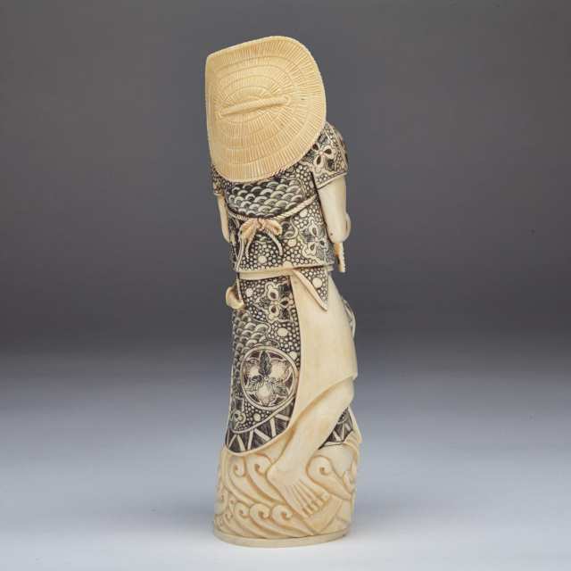 Tinted Ivory Figure of a Fisherman, Circa 1950 
