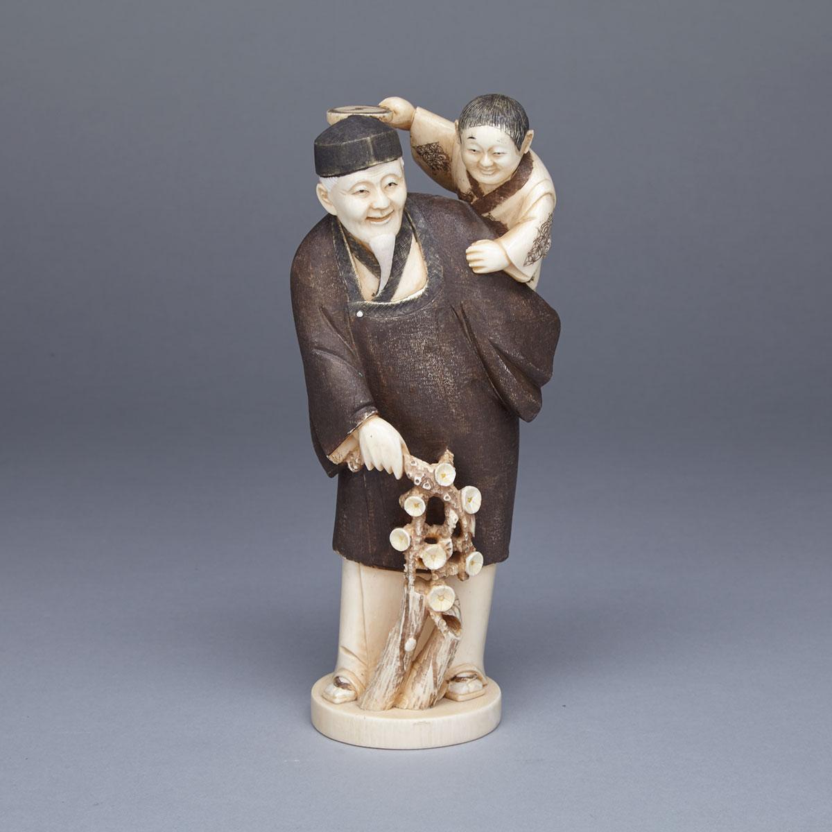 Ivory Carved Okimono of a Father and Son, Signed, Meiji Period, Late 19th Century