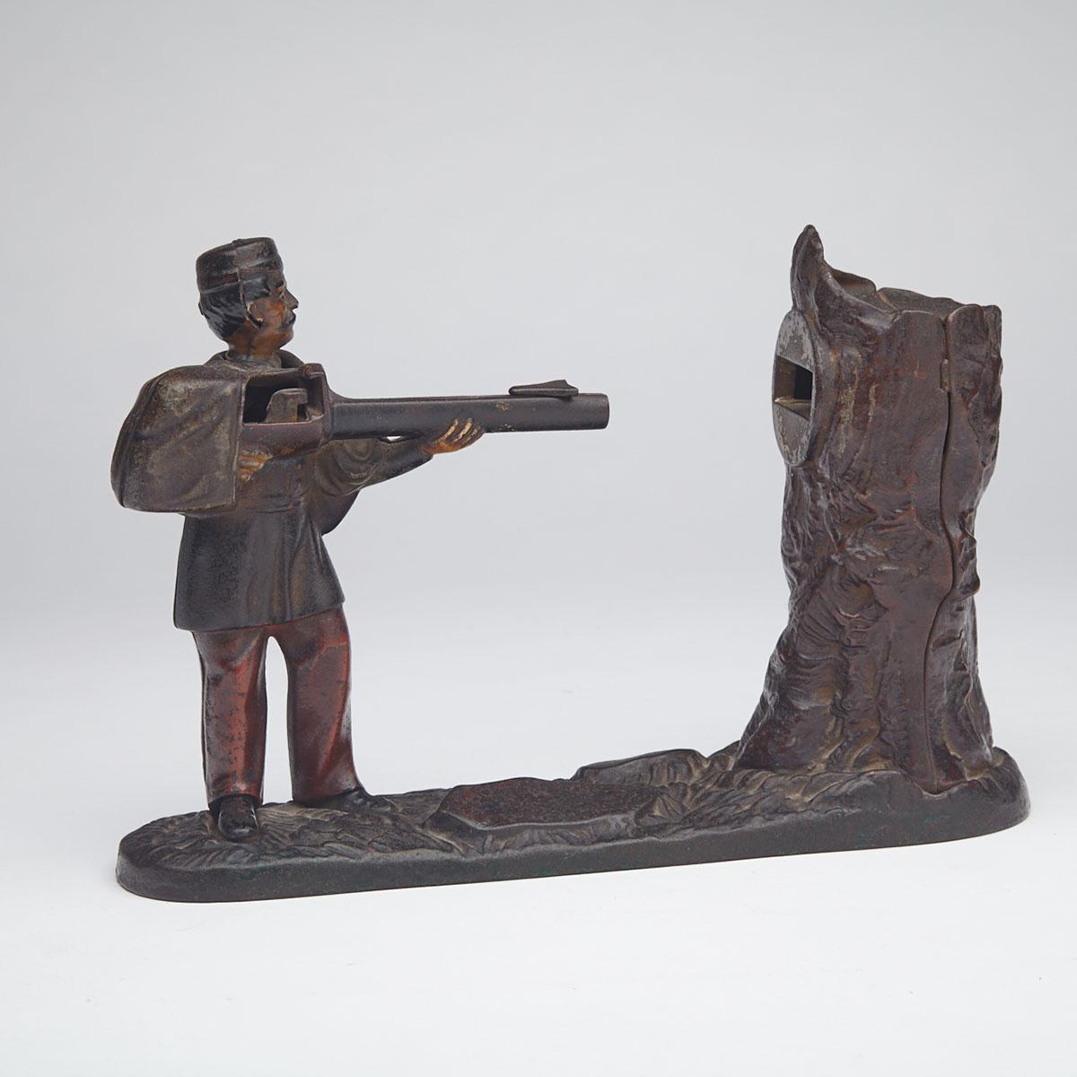 J. & E. Stevens ‘Creedmoor’ Soldier and Treestump Painted Cast Iron Mechanical Bank, 19th century