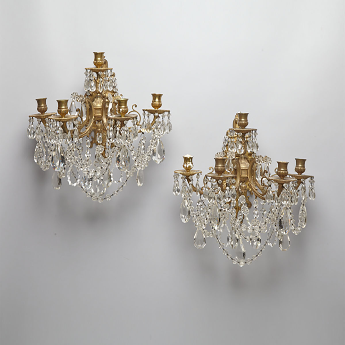 PAIR OF CUT GLASS MOUNTED BRASS FIVE-CANDLE WALL SCONCES, EARLY 20TH CENTURY

