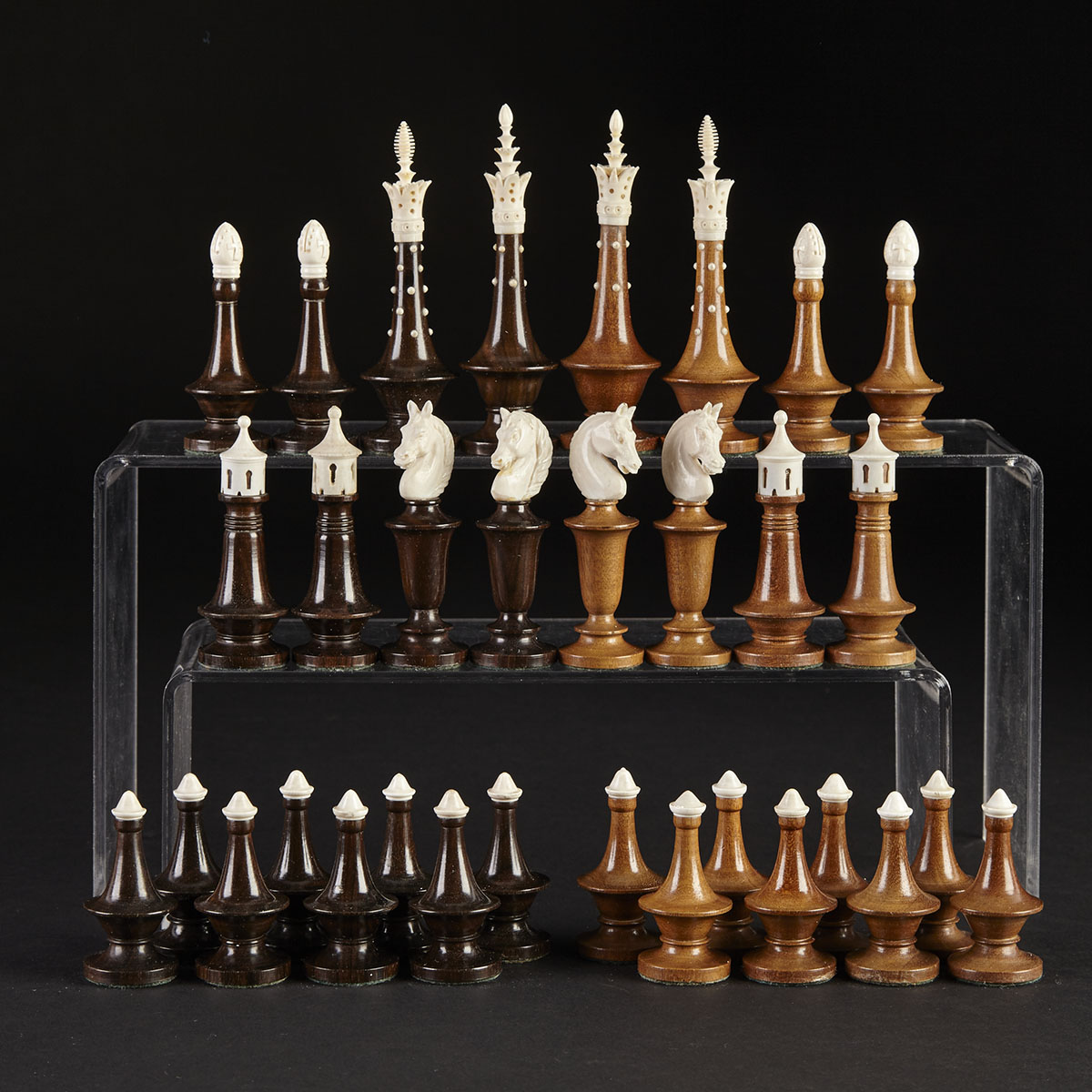 German Ivory Mounted Ebony and Walnut Chess Set, mid 20th century