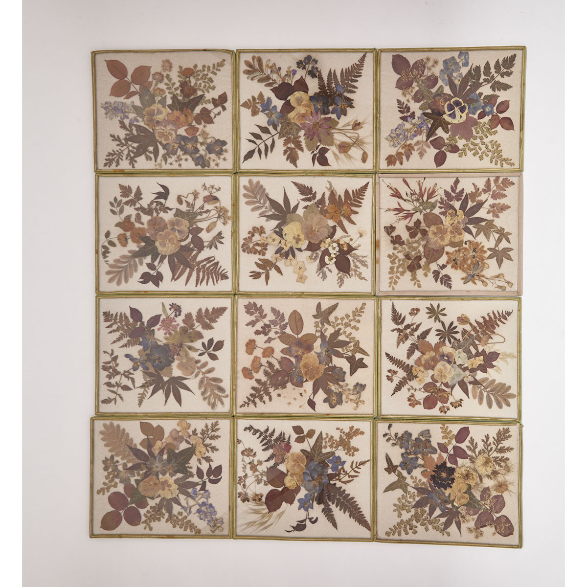 Set of Twelve Glazed Botanical Collage Placemats, early 20th century