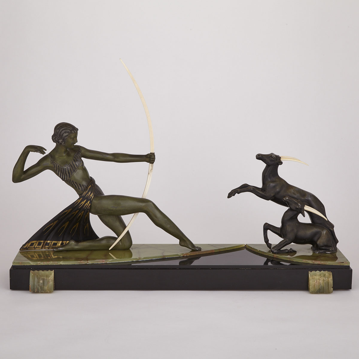 French Art Deco Patinated Metal and Ivory Mantel Group of Diana Hunting Gazelles, c.1925