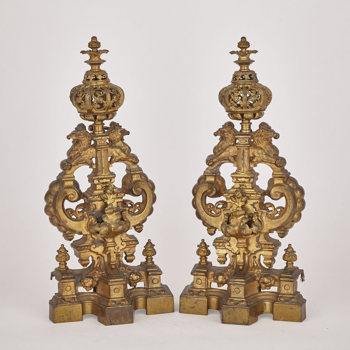 Pair of English Renaissance Revival Gilt and Lacquered Brass Armorial Andirons, 19th century
