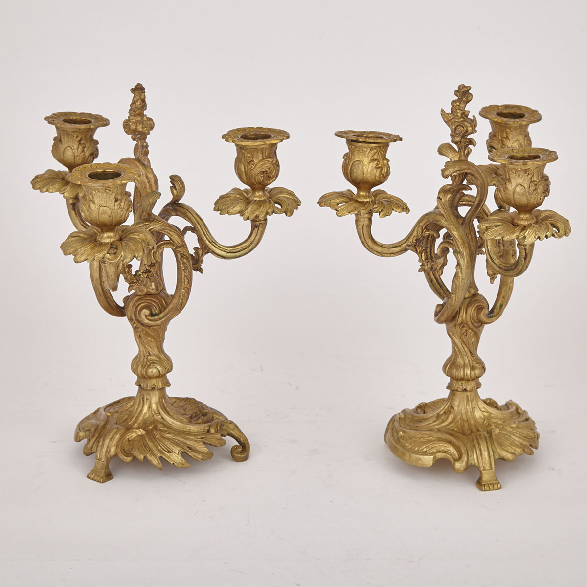 Small Pair of French Rococo Gilt Bronze Three Light Candelabra, 19th century