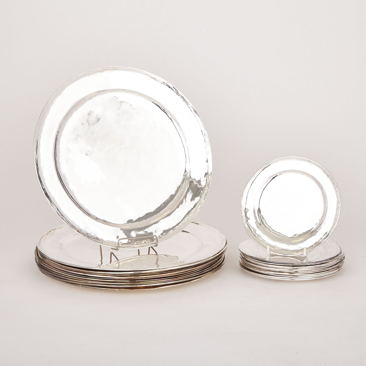 Eleven Peruvian Silver Service Plates and Twelve Side Plates, 20th century