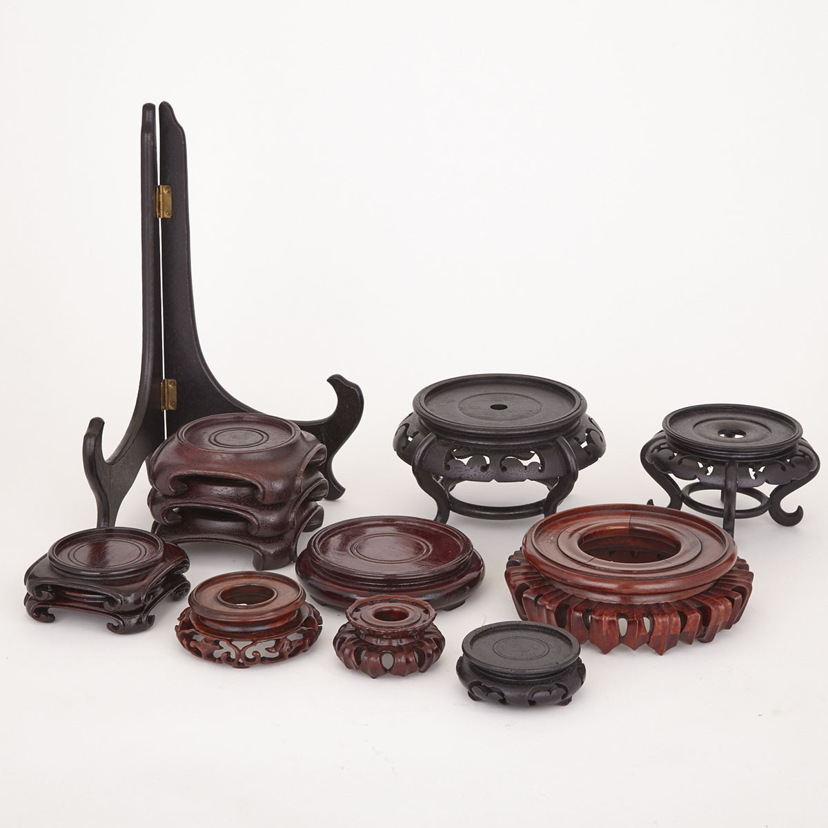 Group of Thirteen Carved Wood Stands