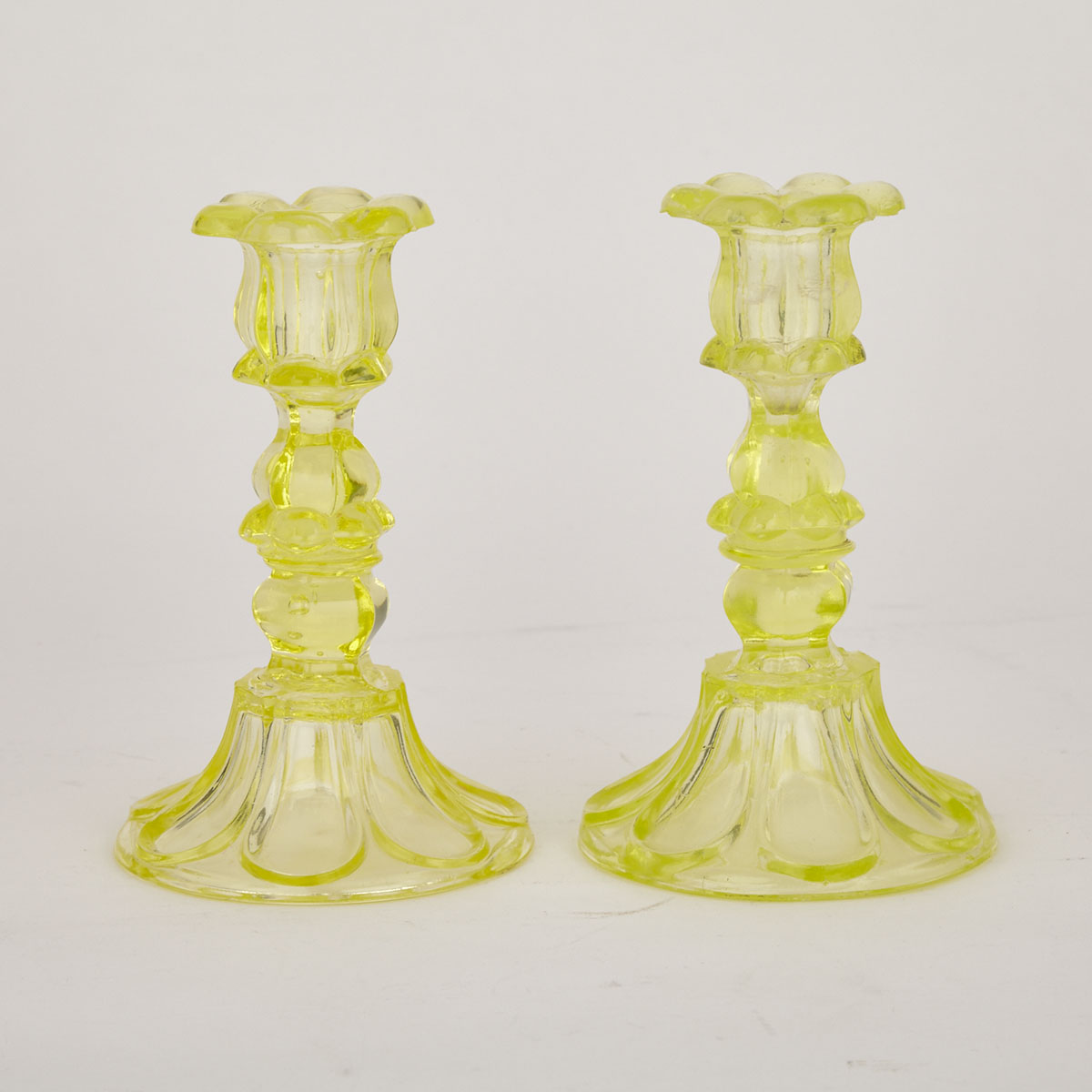Pair of Boston & Sandwich Glass Co. Canary Yellow Petal and Loop Candlesticks, c.1850