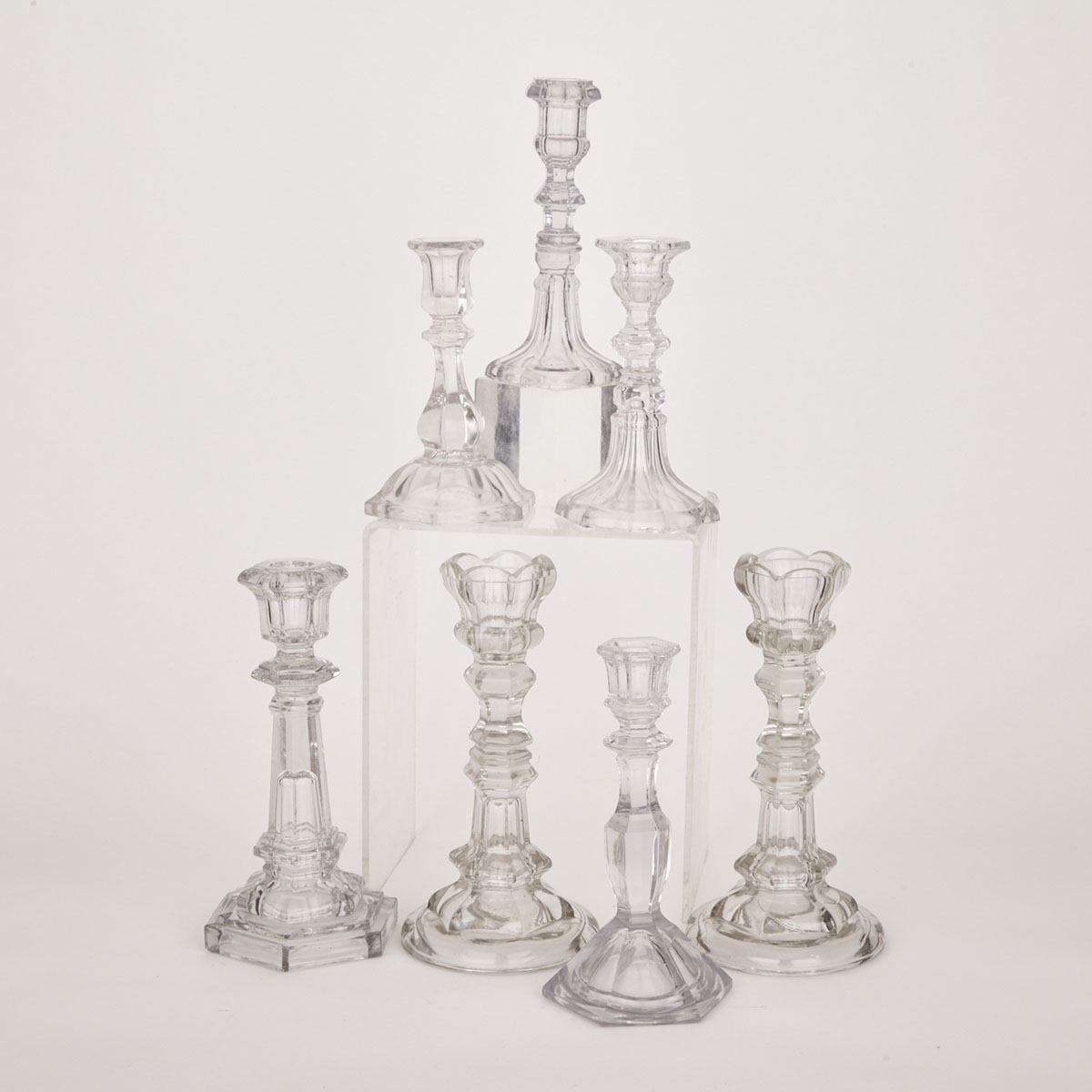 Collection of Seven American Pressed Clear Glass Candlesticks, 19th century