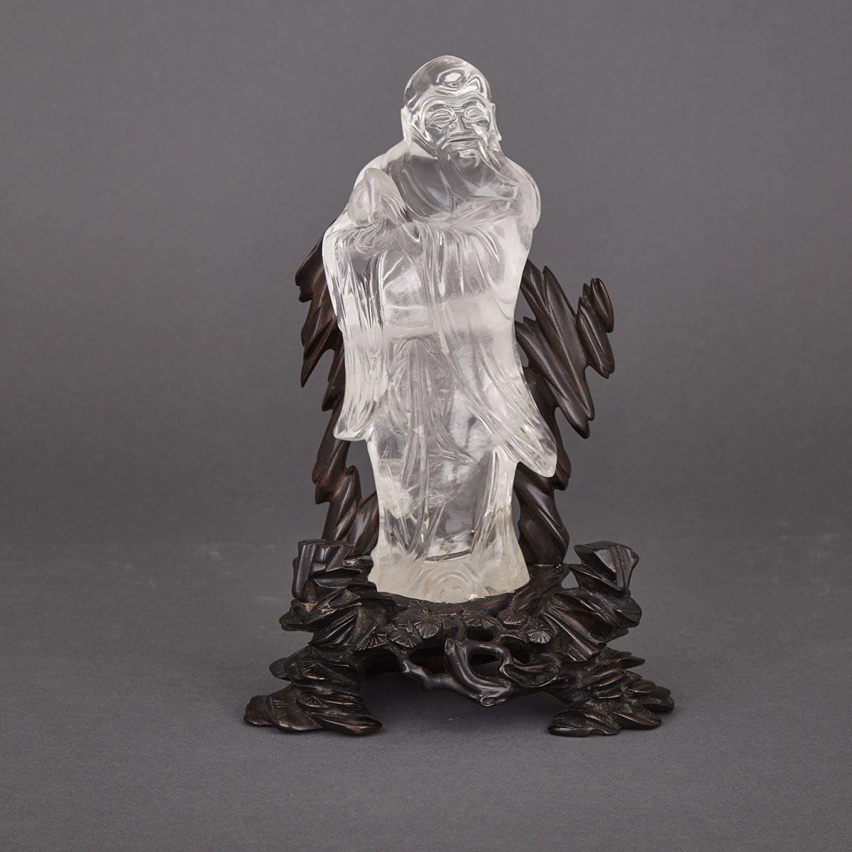 Chinese Carved Rock Crystal Figure of a Deity with Peach, early 20th century