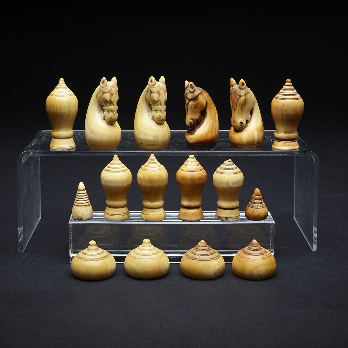 Sixteen Cambodian Turned and Carved Ivory Chess Pieces, early 19th century