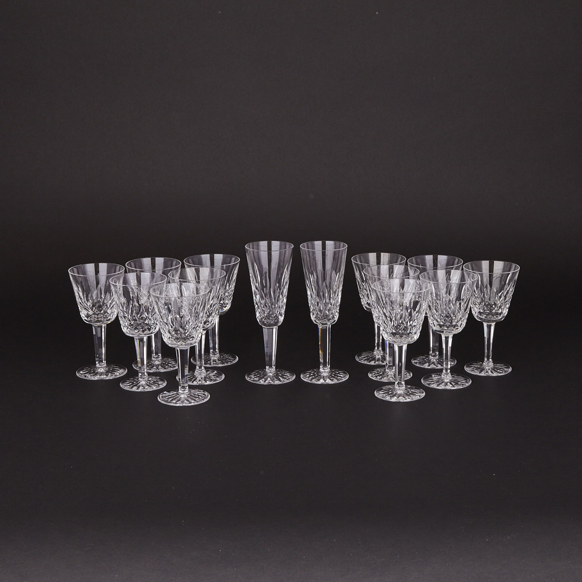 Twelve Waterford ‘Lismore’ Pattern Cut Glass Wine Goblets and Two Champagne Flutes, 20th century