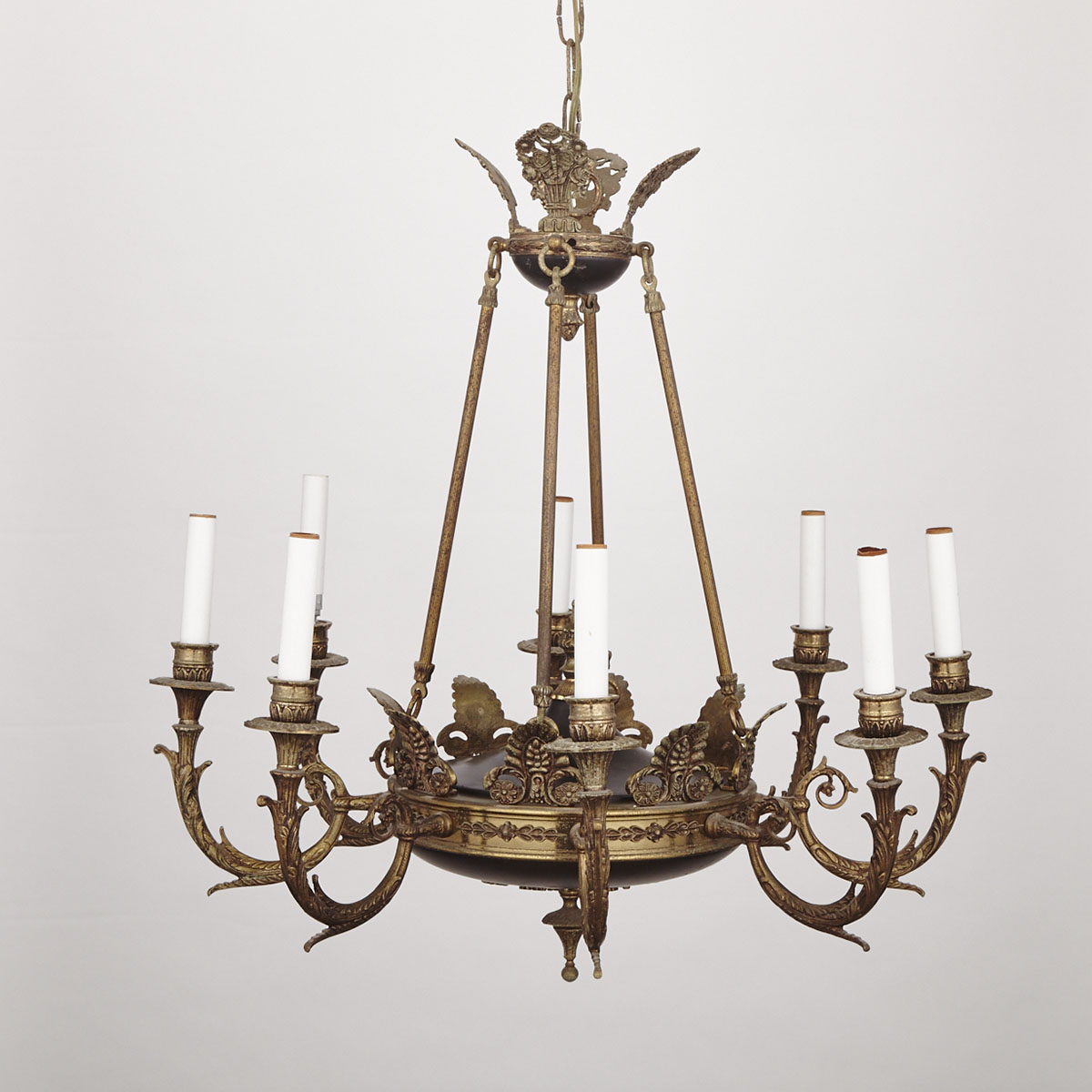 French Gilt and Black Lacquered Metal Empire Style Eight Light Chandelier, early 20th century