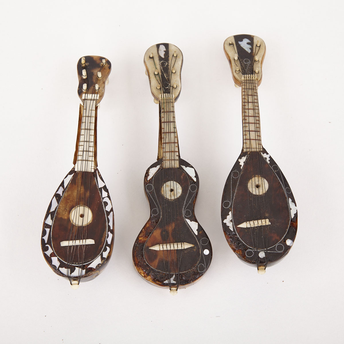 Two Tortoiseshell Veneered Miniature Lutes and a Guitar, 19th/early 20th century