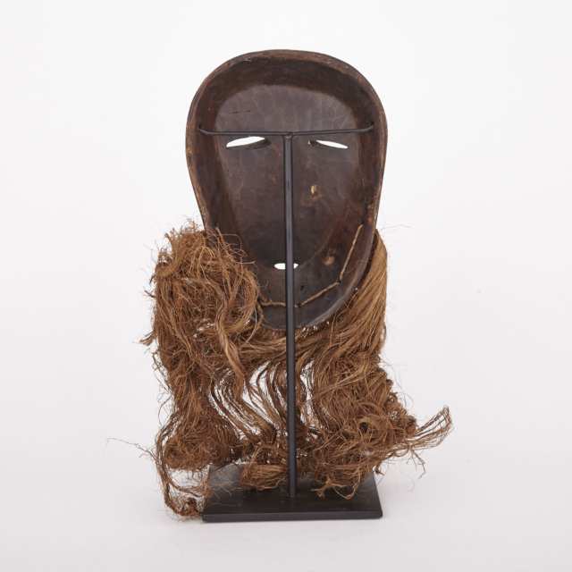 Lega Carved and Painted Wood Mask with fiber beard, Central Africa, 20th century