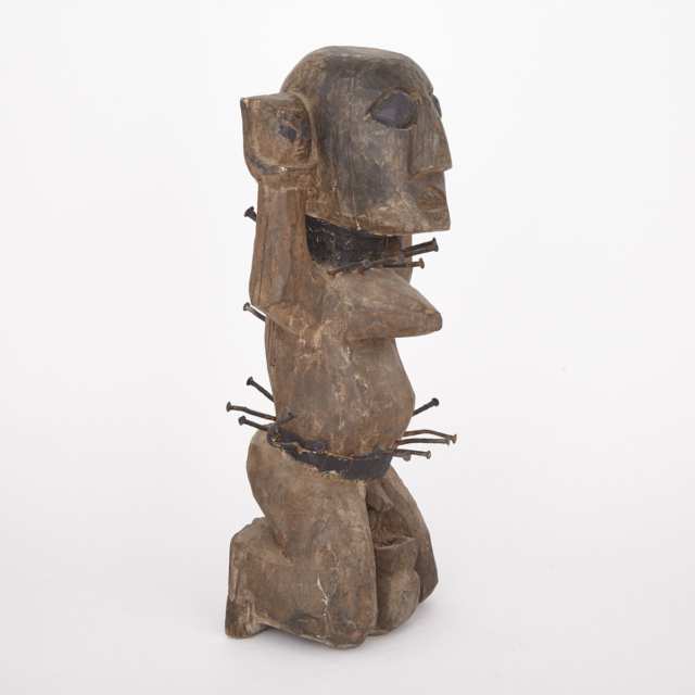 Carved Wood and Painted Fetish Figure with nail decorated waist and collar, Africa, 20th century
