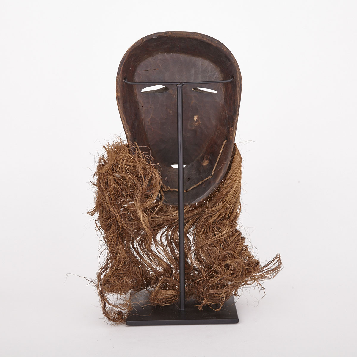 Lega Carved and Painted Wood Mask with fiber beard, Central Africa, 20th century