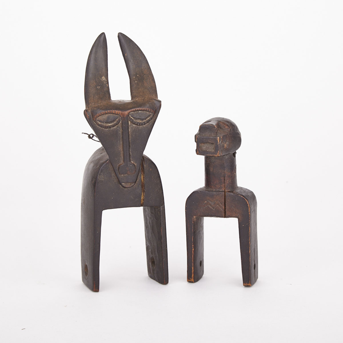 Baule Carved Wood Antelope Heddle Pulley together with a Zoomorphic Carved Wood Heddle Pulley, former West Africa, latter Africa, both 20th century 